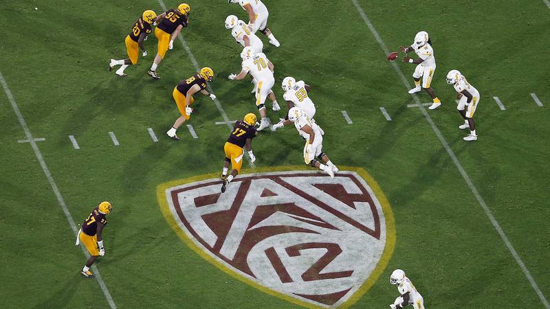 FILE - The Pac-12 logo is shown during the second half of an NCAA college football game between...