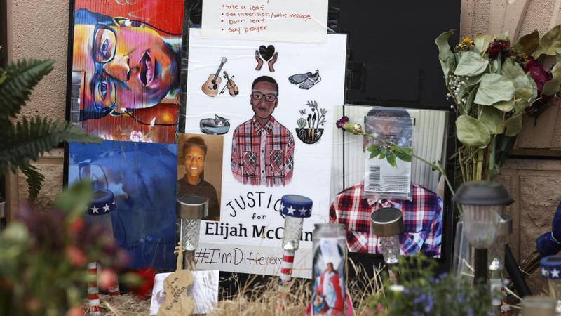 FILE - A makeshift memorial stands at a site across the street from where Elijah McClain was...