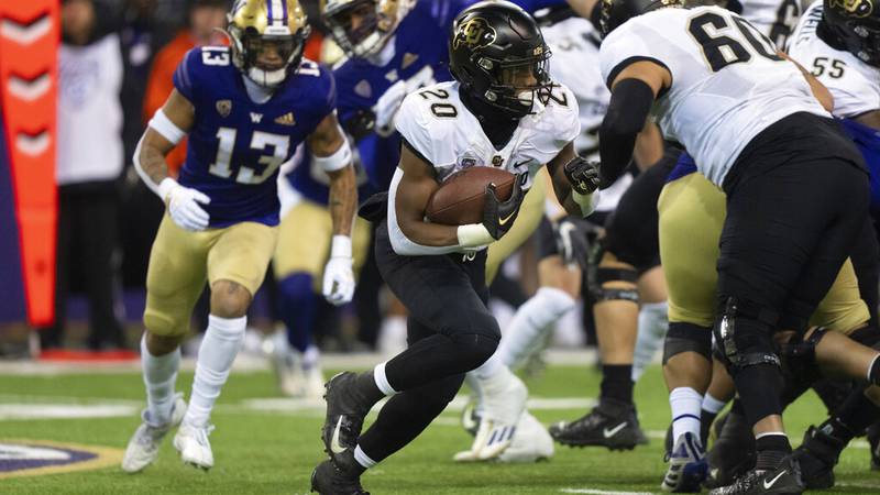Colorado running back Deion Smith run with the ball during an NCAA college football game...