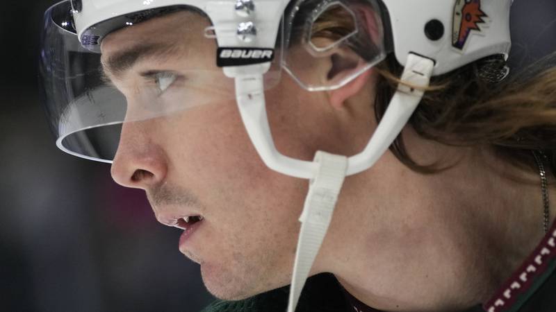 Arizona Coyotes right wing Clayton Keller looks on before an NHL hockey game against the...