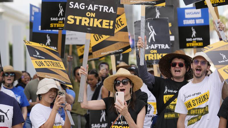 File - People picketing on behalf of the Screen Actors Guild-American Federation of Television...