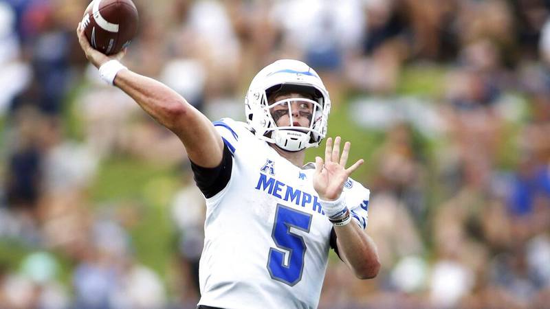 Memphis Tigers quarterback Seth Henigan (5) throws during an NCAA football game against the...