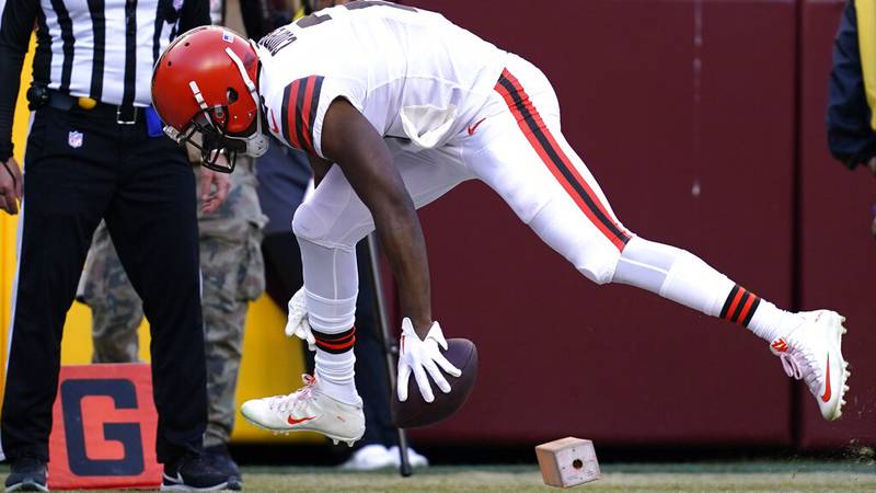 Cleveland Browns wide receiver Amari Cooper (2) knocks the pylon over as he scores a touchdown...