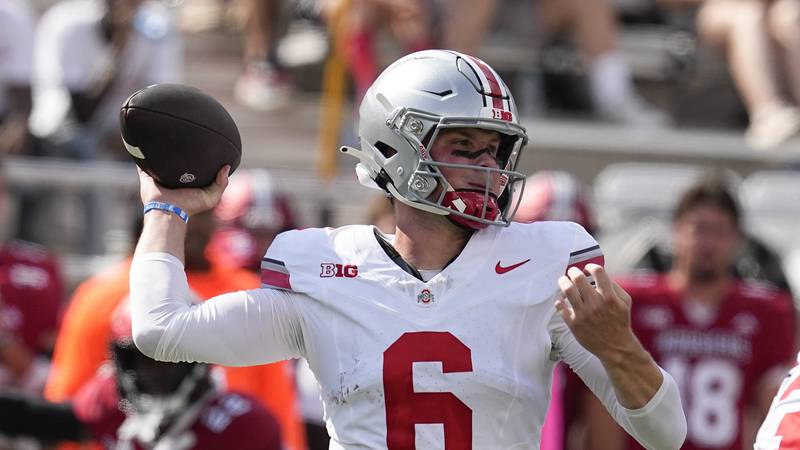 Ohio State quarterback Kyle McCord throws during the first half of an NCAA college football...